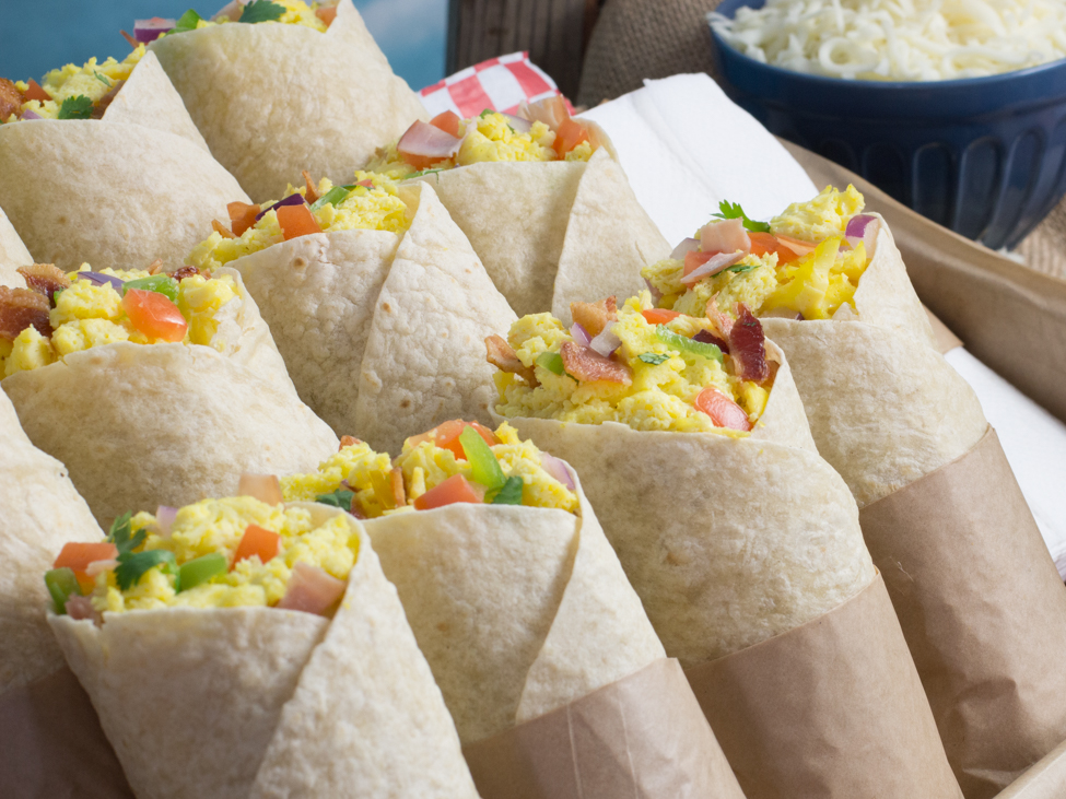 Tray of breakfast burritos up close Tray of breakfast burritos up close
